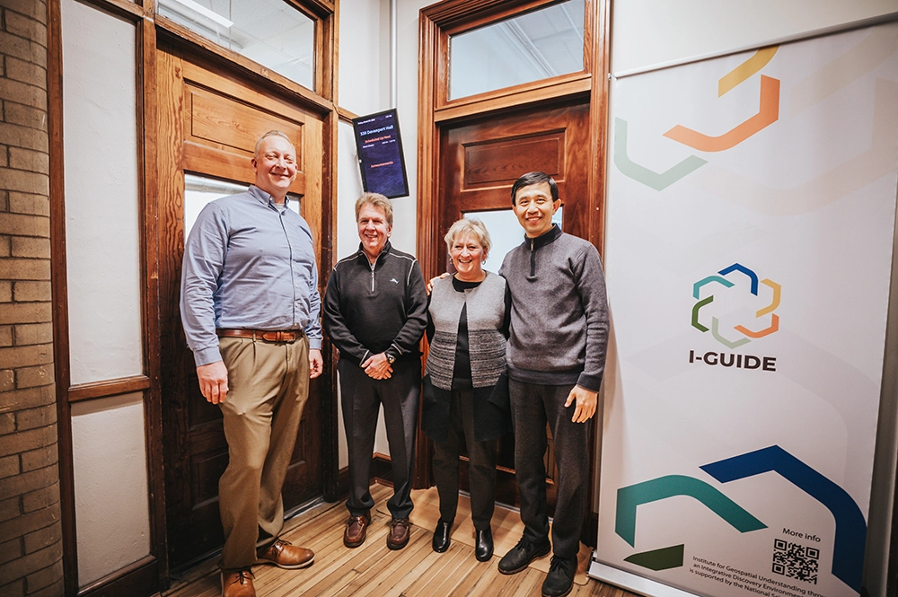 People posing for a picture in the I-GUIDE labratory.